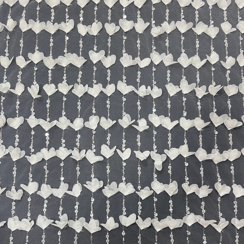 Embroidered lace with scattered sequins