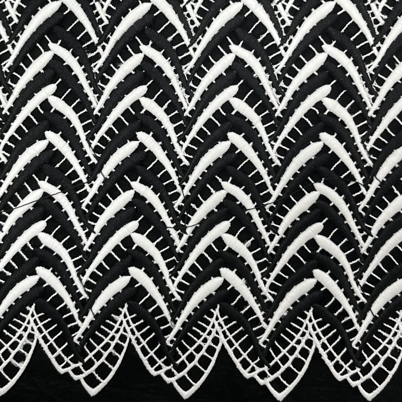 Embroidered net lace with leafy vines