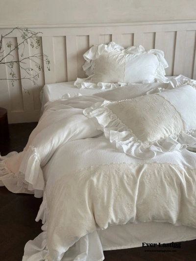 white lace bedding in cozy bedroom